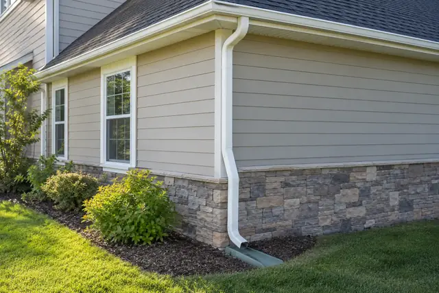 Gutter and connected downspout on a home.