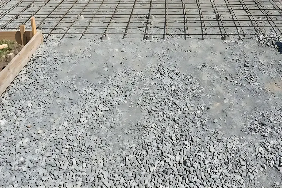 Step 1: Verify 4 to 6 inches of mechanically compacted crushed aggregate sub-base and perimeter formwork.